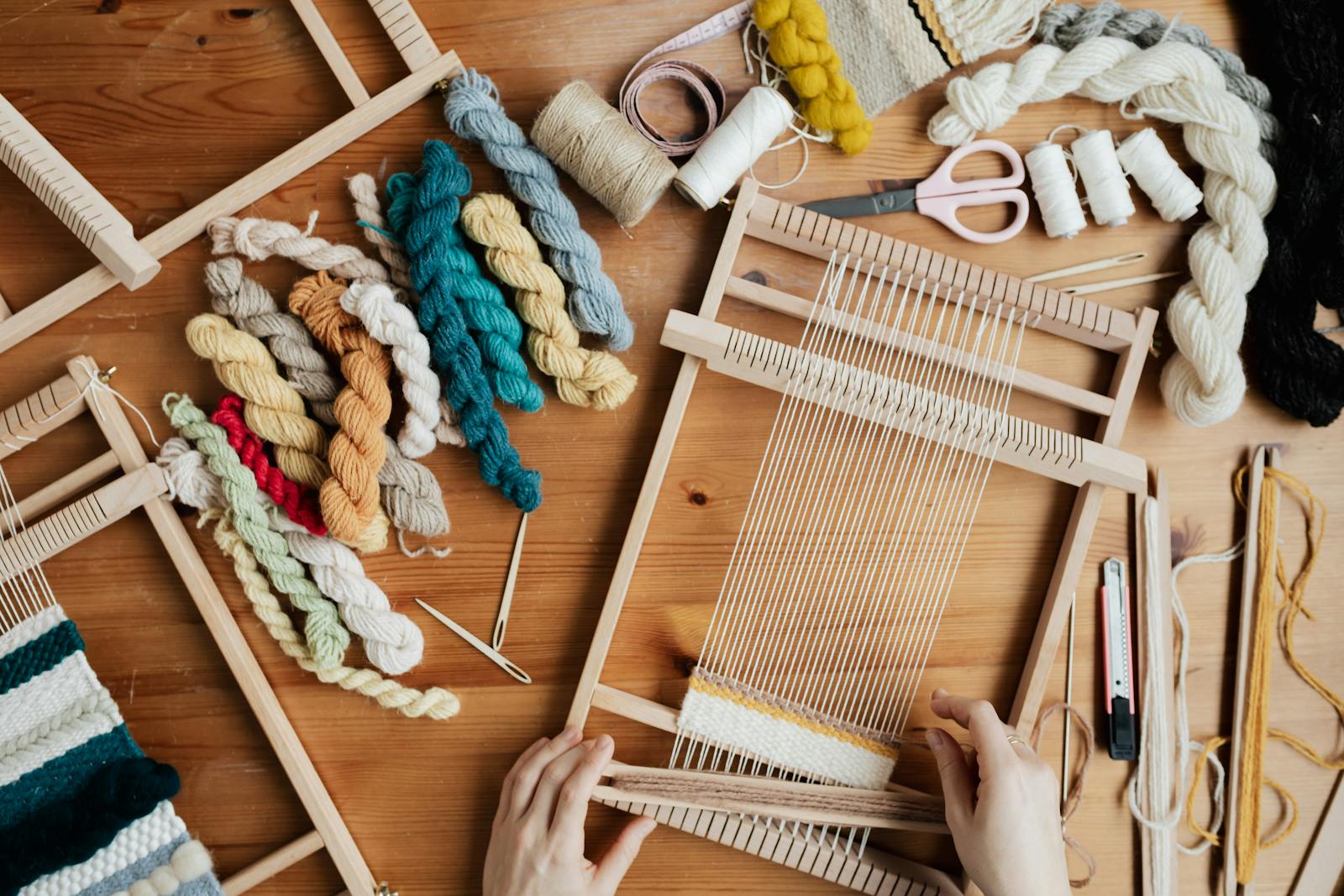 Top View Photo of Person Using Hand Loom