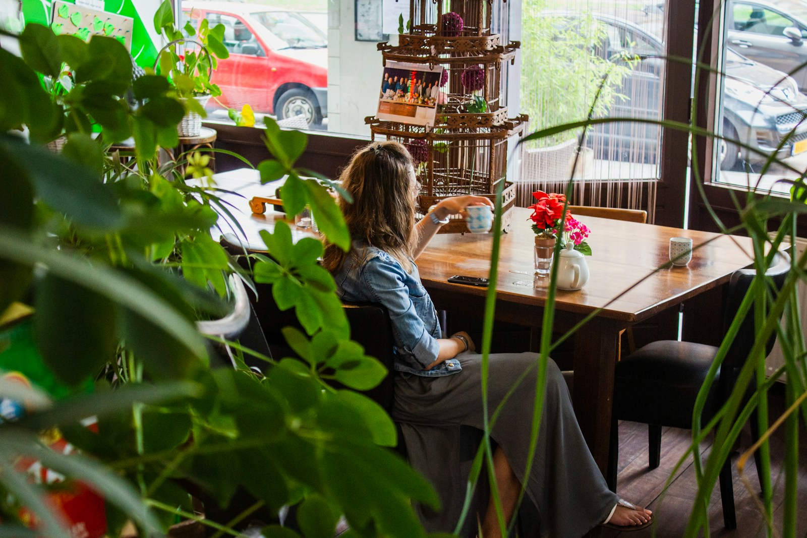 woman sitting near wooden table